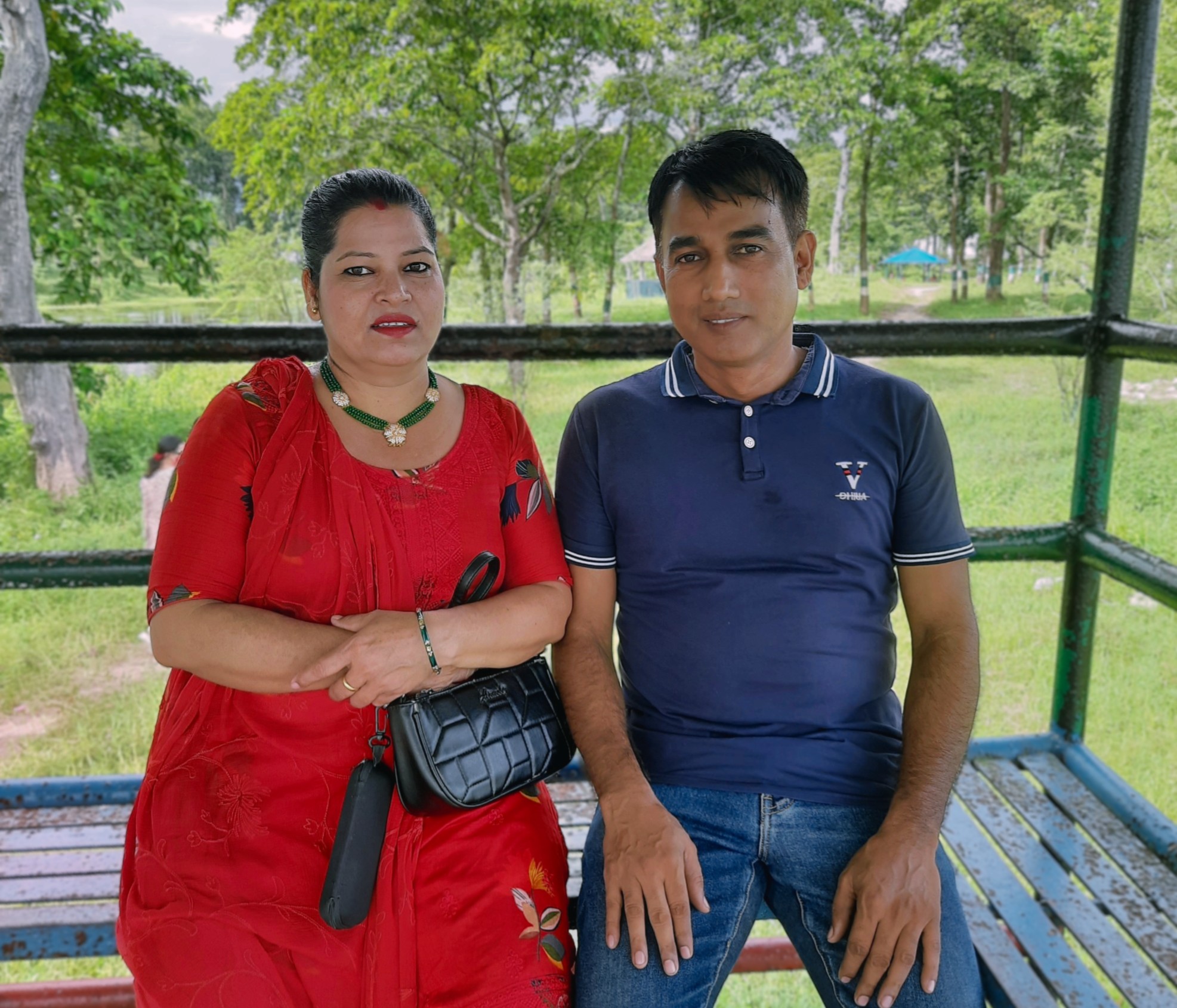 Keshaw and Indu sitting together in a park in Jhapa