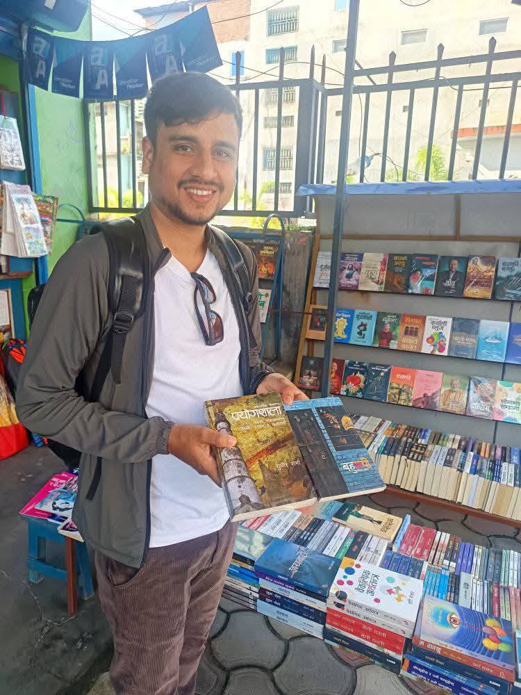 Book shelves and table displays at the front of Isha Books