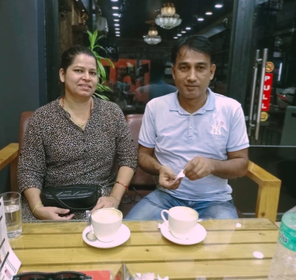 Keshaw and Indu at a cafe table